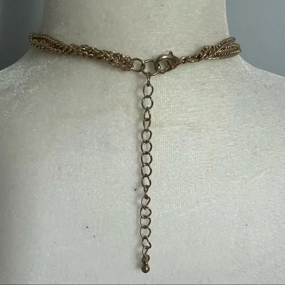 Triple strand gold and rhinestone studded petal necklace